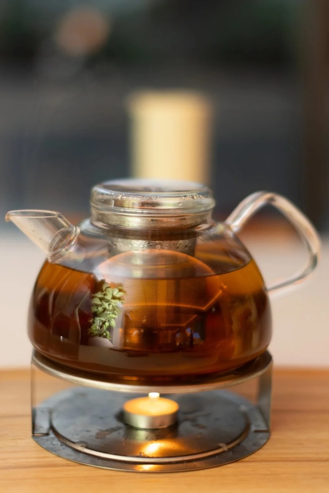 A glass teapot of herbal tea